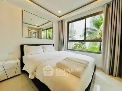 Bright and modern bedroom with large window and stylish decor