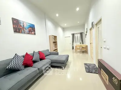 Spacious modern living room with stylish decor and comfortable seating in a bright apartment.