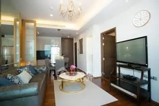 Luxurious living room with elegant chandelier and modern decor in a stylish apartment.