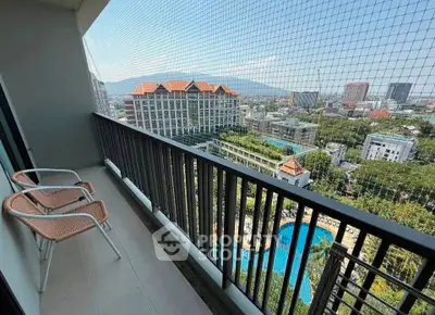 Spacious balcony with stunning city and mountain views, perfect for relaxation and enjoying the scenery.