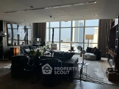 Luxurious living room with panoramic city views and elegant modern furnishings.