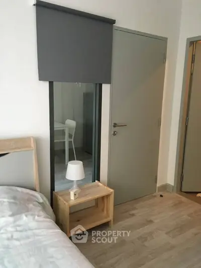 Modern bedroom with minimalist design and wooden flooring
