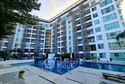 Modern condominium with pool and spacious outdoor area, perfect for luxury living.