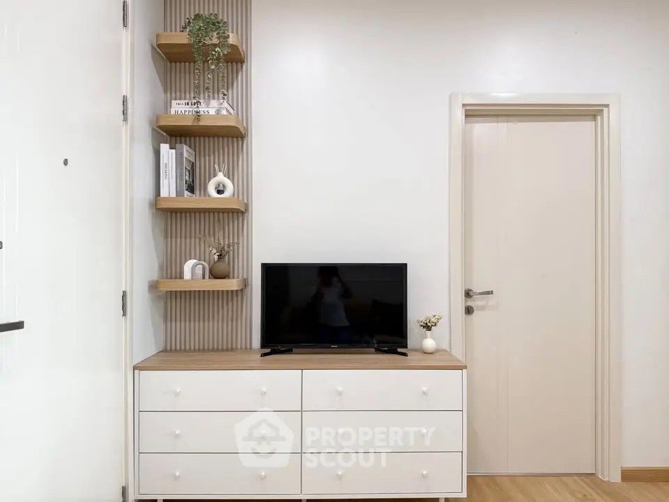 Modern living room with stylish TV stand and decorative shelves