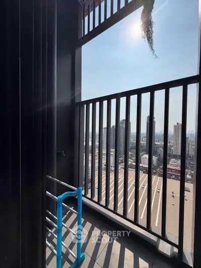 Stunning high-rise balcony with panoramic city views and modern railing design.