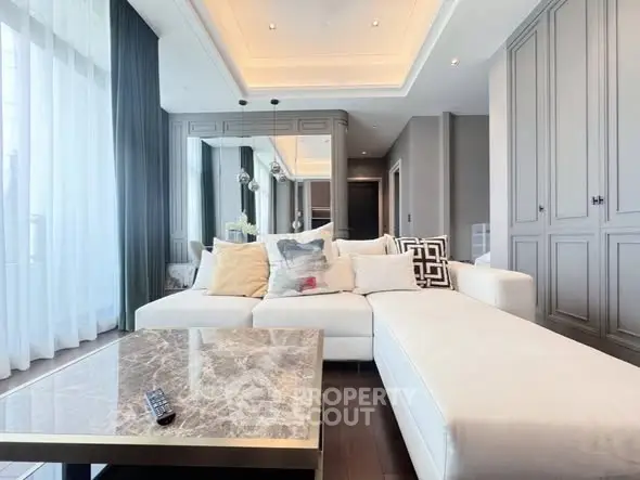 Luxurious modern living room with elegant decor and plush seating in a high-end apartment.