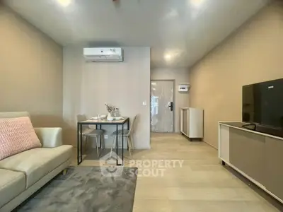 Modern living room with sleek furniture and air conditioning, perfect for cozy living.