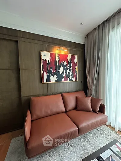 Stylish living room with modern art and leather sofa