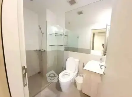 Modern bathroom with glass shower and sleek fixtures