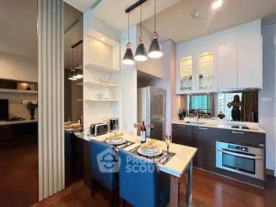 Modern kitchen with sleek design, featuring an open layout, stylish lighting, and contemporary appliances.