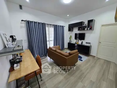 Modern living room with stylish decor and cozy seating area, perfect for relaxation and entertainment.