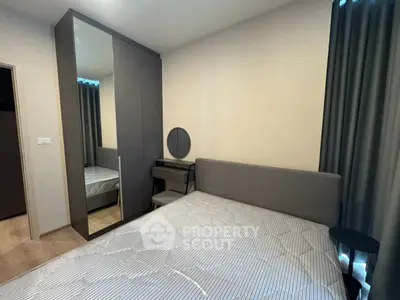 Modern bedroom with sleek wardrobe and stylish decor
