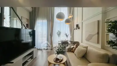 Luxurious modern living room with high ceilings, elegant decor, and large windows offering natural light.