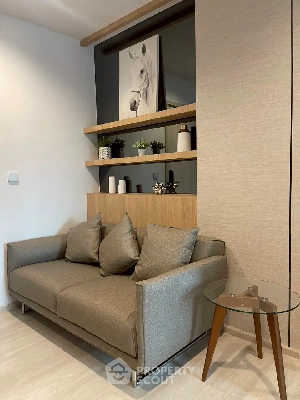 Modern living room with stylish sofa and decorative shelves