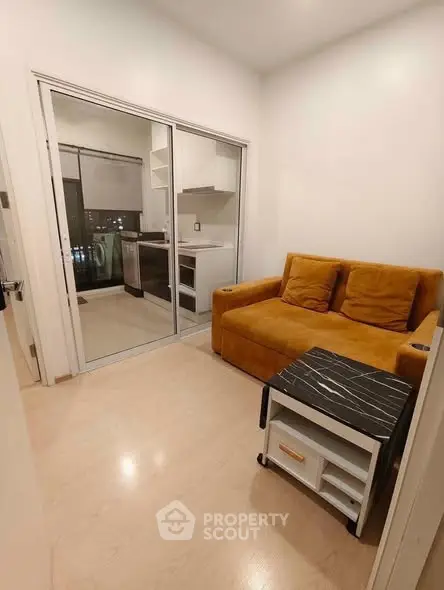 Cozy living room with modern kitchen view and stylish furniture