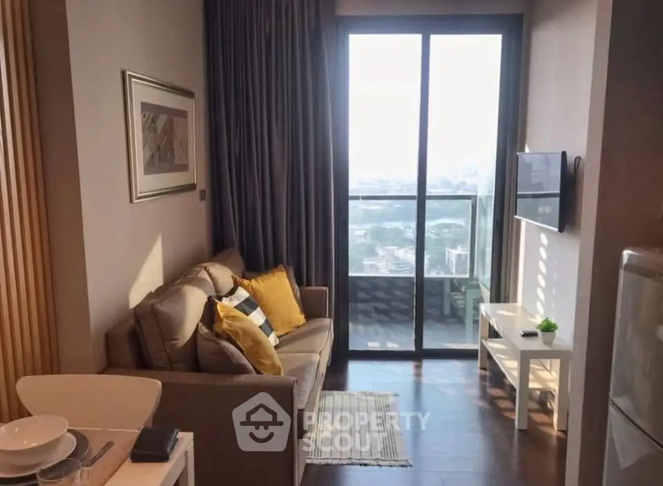 Cozy living room with balcony view in modern apartment