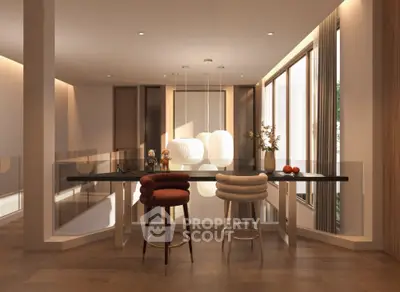 Modern kitchen with elegant bar stools and pendant lighting in a luxurious open layout.