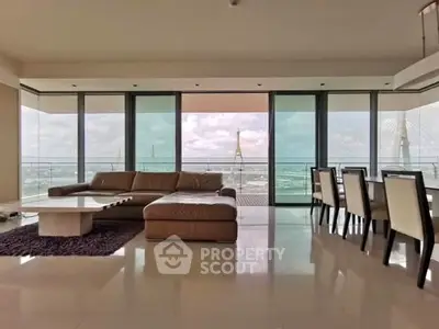 Luxurious living room with panoramic city view and elegant furnishings.