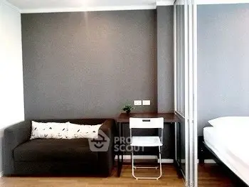 Modern living space with cozy sofa and sleek desk setup