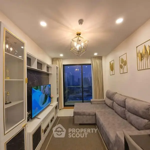 Luxurious living room with modern decor and city view, featuring elegant lighting and plush seating.