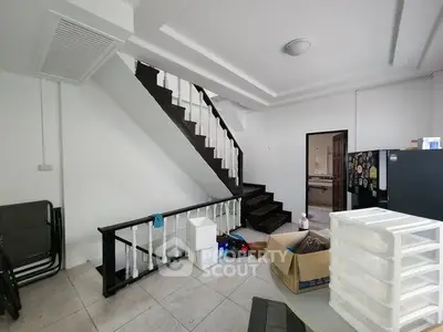 Spacious interior with staircase and storage, ideal for customization.