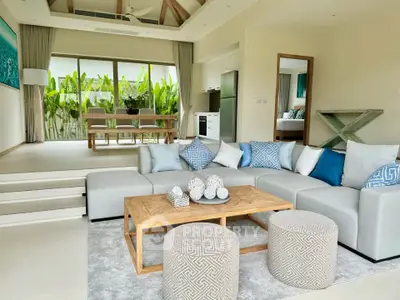 Luxurious open-plan living room with modern decor and garden view
