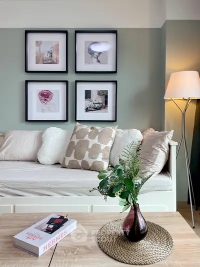 Stylish living room with cozy sofa and elegant decor, perfect for relaxation.