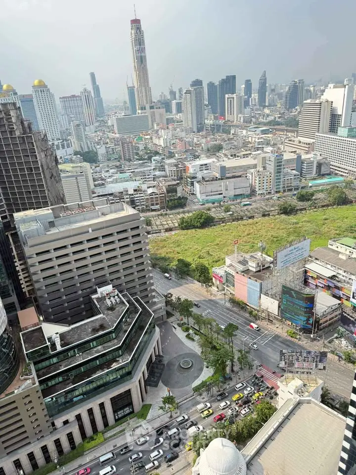 Stunning cityscape view from high-rise building showcasing urban skyline and bustling streets.