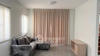 Spacious living room with modern sofa and natural light