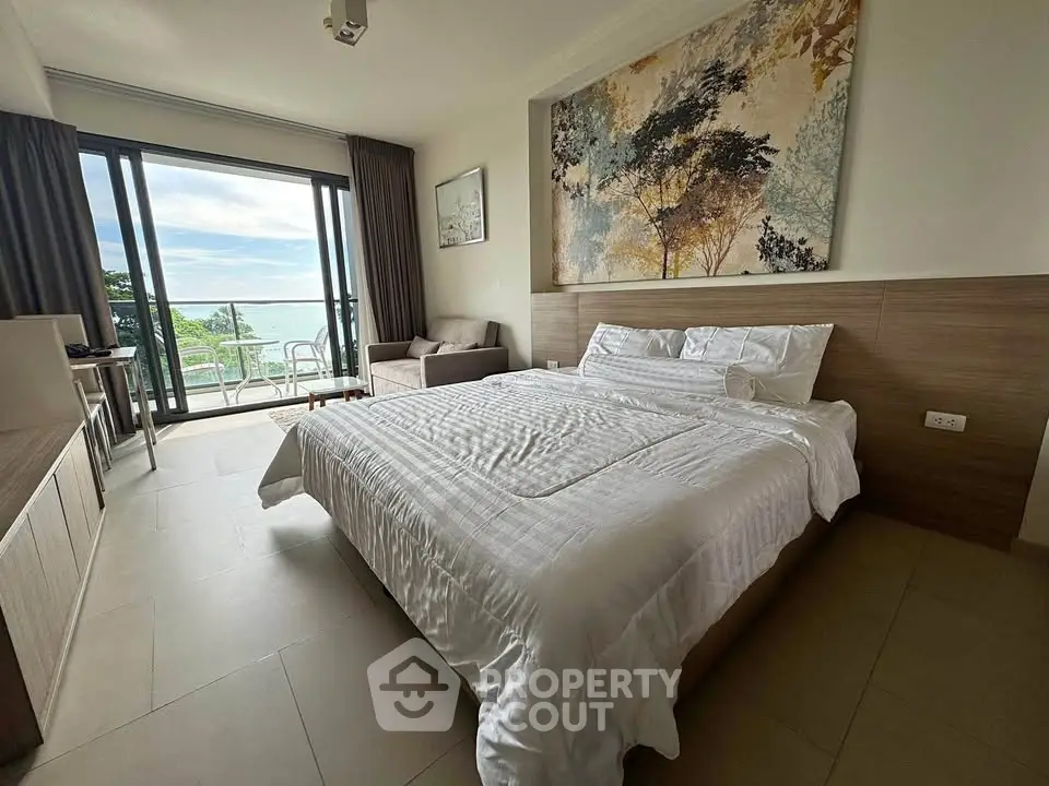 Luxurious bedroom with balcony and stunning sea view, perfect for relaxation and comfort.