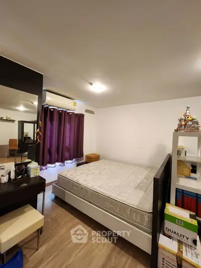 Cozy bedroom with modern decor and ample storage space