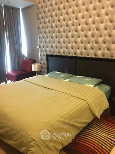 Cozy bedroom with stylish wallpaper and modern furnishings