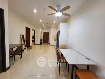 Spacious modern dining area with sleek furniture and ceiling fan