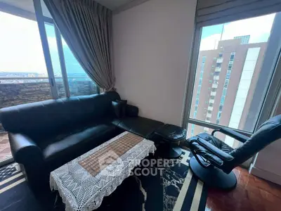 Luxurious living room with stunning city view and elegant furnishings.