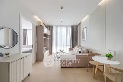 Modern living room with cozy sofa and natural light in stylish apartment
