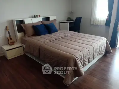 Cozy bedroom with stylish decor and natural light