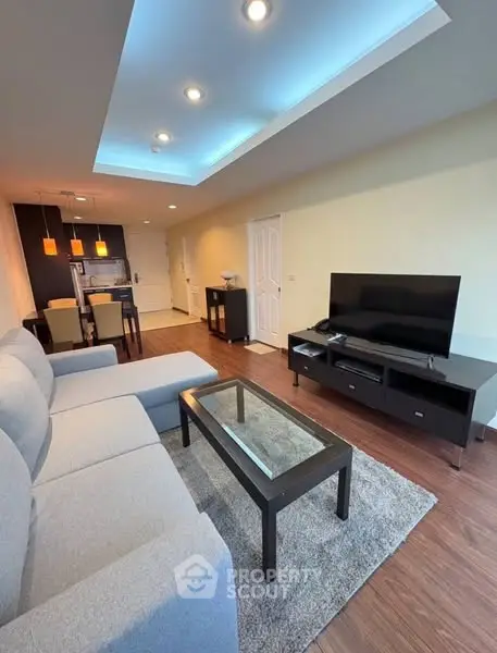 Modern living room with stylish furniture and open kitchen layout