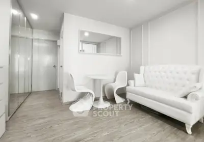 Modern minimalist living room with white furniture and sleek design