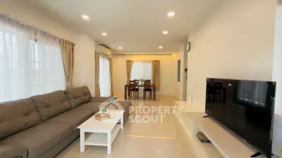 Spacious modern living room with sleek furniture and ample natural light