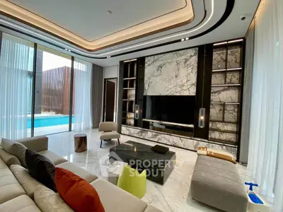 Luxurious modern living room with marble accents and pool view, featuring elegant furniture and stylish decor.