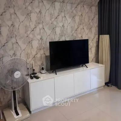 Modern living room with stylish marble wallpaper and sleek TV setup