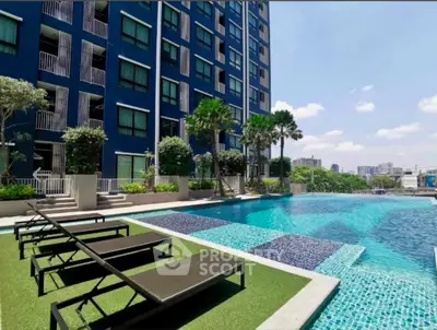 Luxurious apartment complex with stunning pool and city view, perfect for relaxation and leisure.