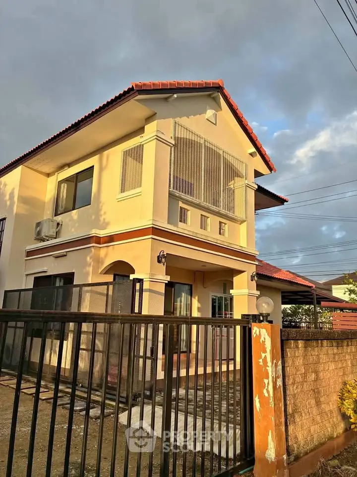 Charming two-story house with modern design and spacious outdoor area, perfect for family living.