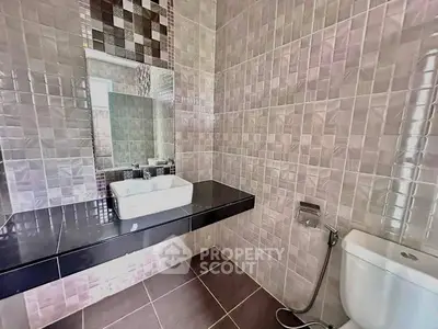 Modern bathroom with sleek tile design and contemporary fixtures