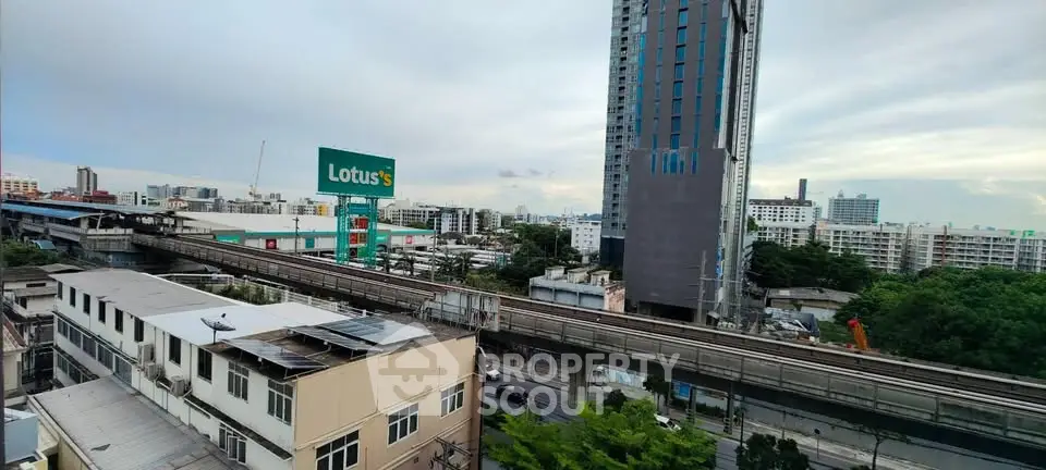 Urban cityscape view with modern high-rise buildings and railway track