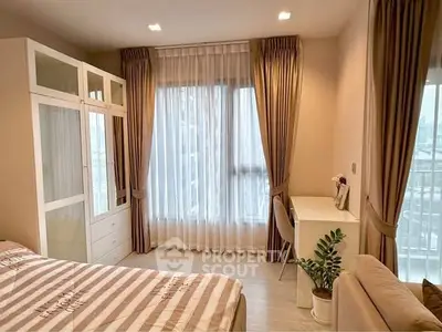 Bright and cozy bedroom with elegant curtains and modern furniture