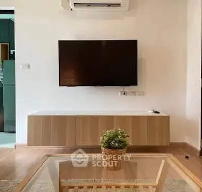 Modern living room with wall-mounted TV and stylish decor