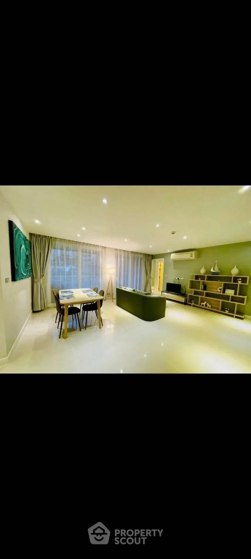 Spacious modern living room with elegant dining area and stylish decor