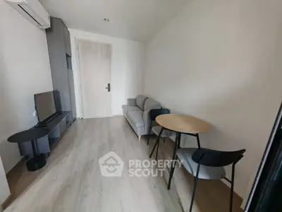 Modern minimalist living room with sleek furniture and wooden flooring