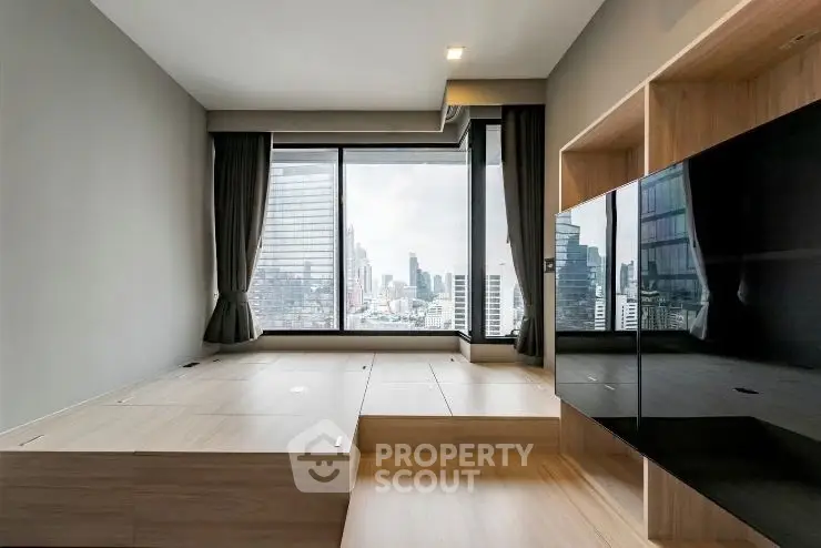 Modern living room with city view and sleek wooden flooring